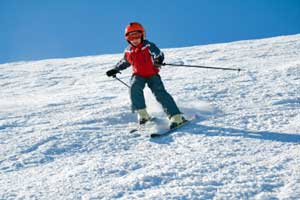 photo of young skier on slope